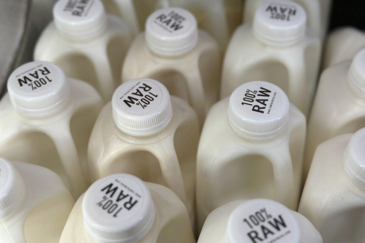 Bottles of raw milk are displayed for sale at a store in Temecula, Calif., on Wednesday, May 8, 2024. Sales of raw milk appear to be on the rise, despite an outbreak of bird flu in U.S. dairy cows. Federal officials warn about the health risks of drinking raw milk at any time, but especially during this novel outbreak.
