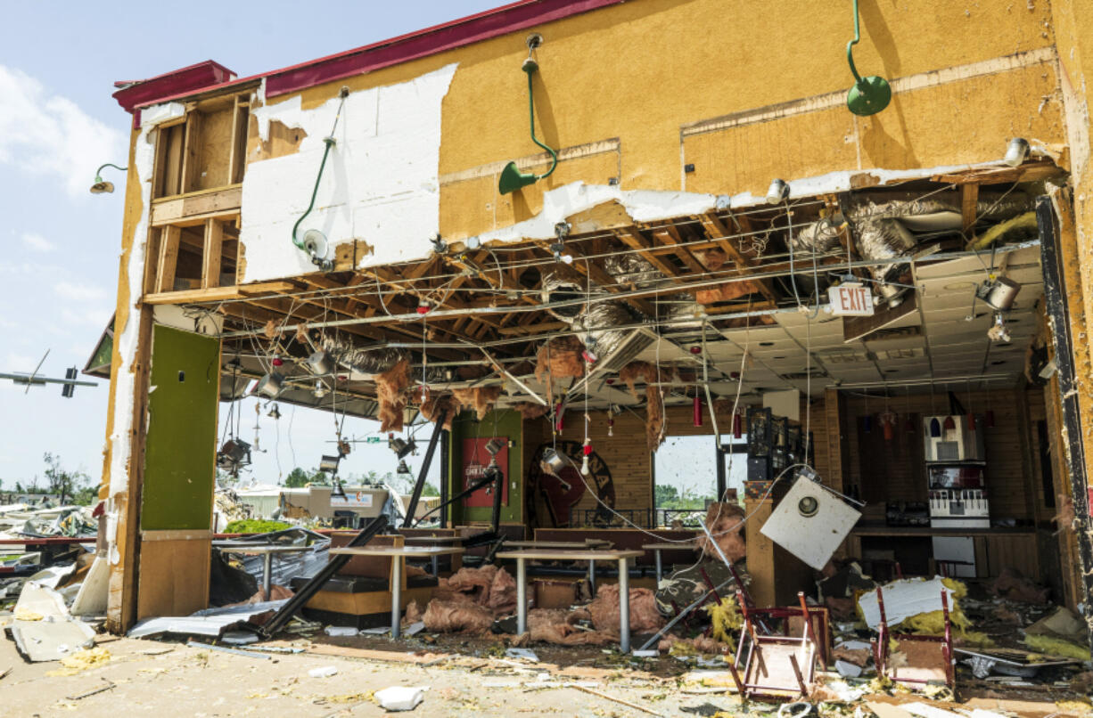 Popeyes is damaged from the storm at the shopping center on West Walnut Avenue and North 24th Street Sunday, May 26, 2024, in Rogers, Ark.