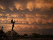A formation of Mammatus clouds fills the sky over Wichita, Kan., on Tuesday, April 30, 2024. Mammatus clouds usually form on the back side of severe thunderstorms. A line of severe storms crossed the state Tuesday afternoon and evening, including a few tornados in the northeastern part of Kansas.
