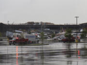 Emergency vehicles respond after a tornado damaged a FedEx facility in Portage, Mich., Tuesday, May 7, 2024.