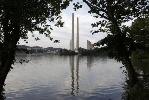 FILE - In this Aug. 7, 2019, photo, the Kingston Fossil Plant stands near a waterway in Kingston, Tenn. The nation&rsquo;s largest public utility is moving ahead with a plan for a new natural gas plant in Tennessee despite warnings that its environmental review of the project doesn&rsquo;t comply with federal law. The Environmental Protection Agency asked the Tennessee Valley Authority in a March 25, 2024 letter to redo several aspects of its environmental impact statement for converting the coal-burning Kingston Fossil Plant.