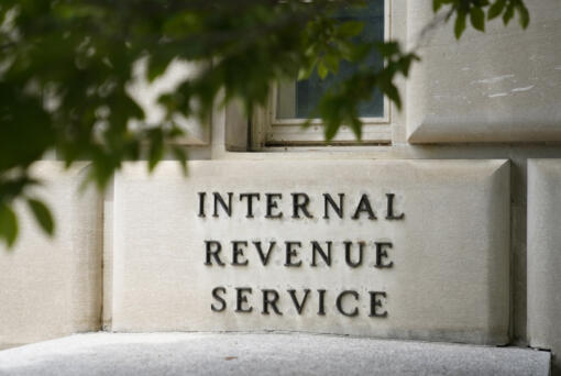 FILE - A sign outside the Internal Revenue Service building is seen, May 4, 2021, in Washington. The IRS said Thursday, May 2, 2024, it&rsquo;s taken steps to address a wide disparity in audit rates between Black taxpayers and others filers. And the agency is more closely examining the returns of larger numbers of wealthy people and major companies.
