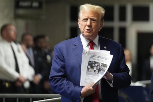Former President Donald Trump speaks to members of the media before entering the courtroom at Manhattan criminal court, Monday, May 6, 2024, in New York.