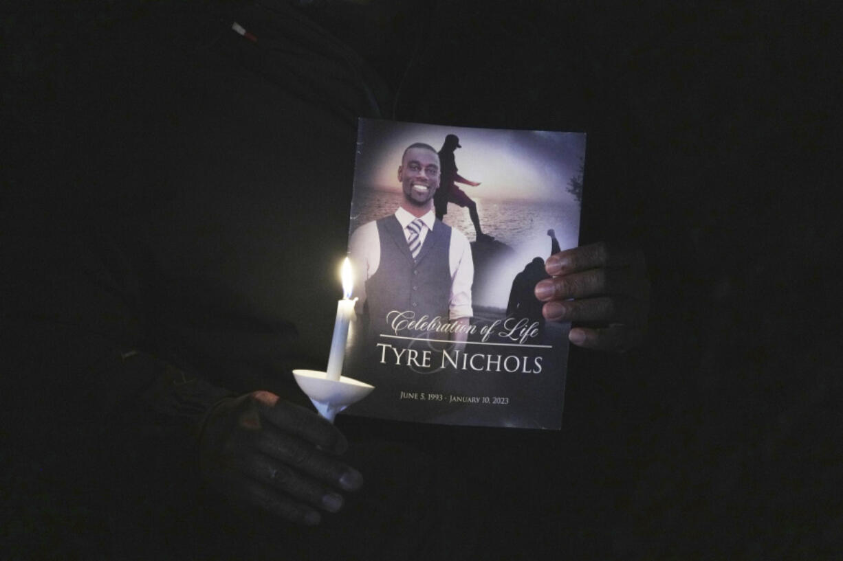 FILE - A crowd gathers to remember Tyre Nicholas during a candlelight vigil on the anniversary of his death, Jan. 7, 2024, in Memphis, Tenn. A federal judge heard arguments Tuesday, May 28 about whether the jury at the trial of four former Memphis police officers charged in the beating death of Tyre Nichols should hear evidence that Nichols had a hallucinogenic drug and stolen credit cards in his car when he was pulled over that night.