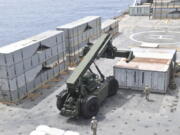 In this image provided by the U.S. Army, soldiers assigned to the 7th Transportation Brigade (Expeditionary) and sailors attached to the MV Roy P. Benavidez assemble the Roll-On, Roll-Off Distribution Facility (RRDF), or floating pier, off the shore of Gaza on April 26, 2024. The U.S. expects to have on-the-ground arrangements in Gaza ready for humanitarian workers to start delivering aid this month via a new U.S.-backed sea route for Gaza aid. An official with the U.S. Agency for International Development tells the AP that humanitarian groups expect to have their part of preparations complete by early to mid-month. (U.S.