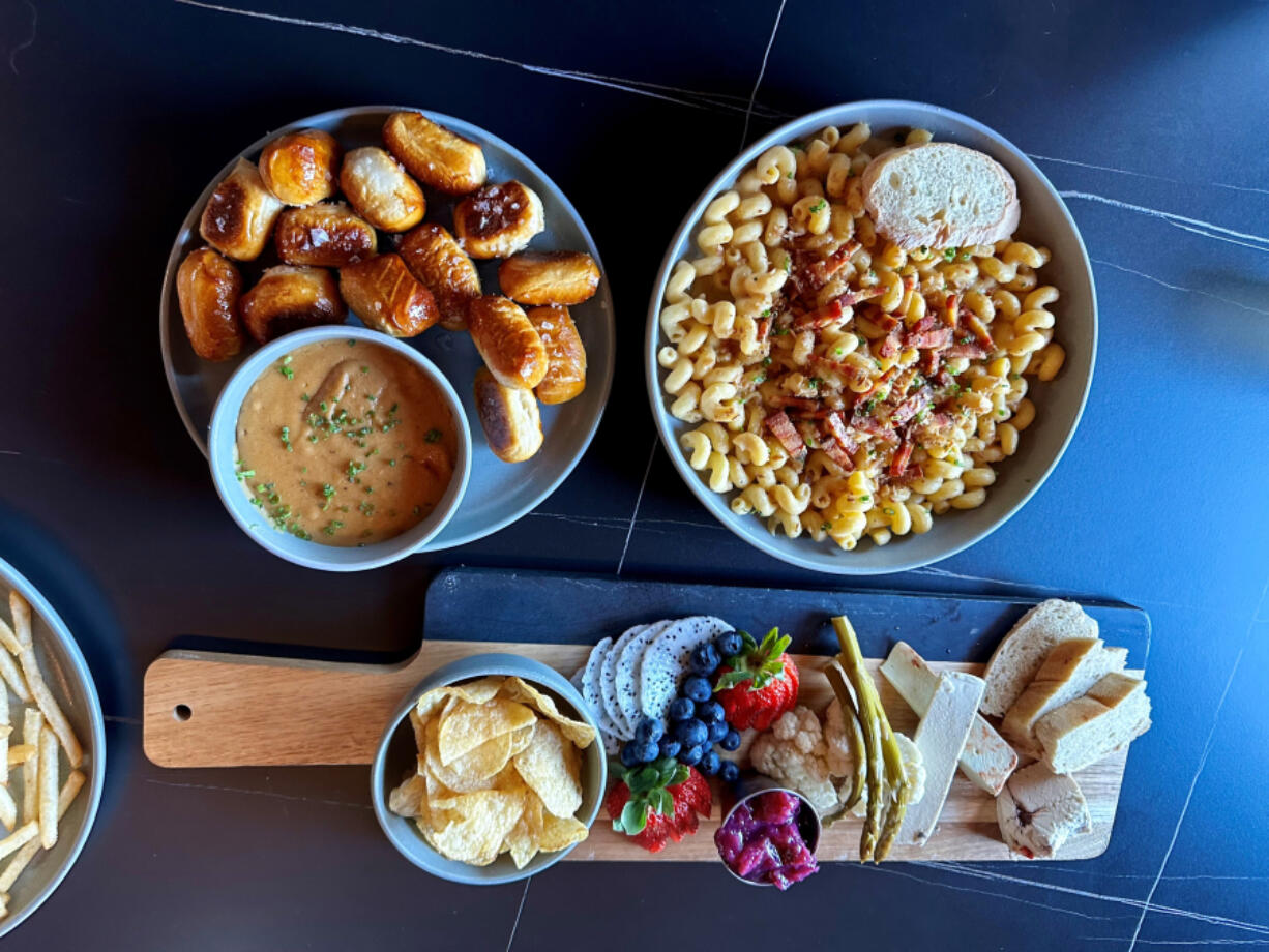 Pretzel Bites and Beer Cheeze, Bakon Mac and Cheeze, and Girl Dinner are among the delicious plant-based options at 3 Howls Remedy House in Vancouver&rsquo;s Uptown Village.