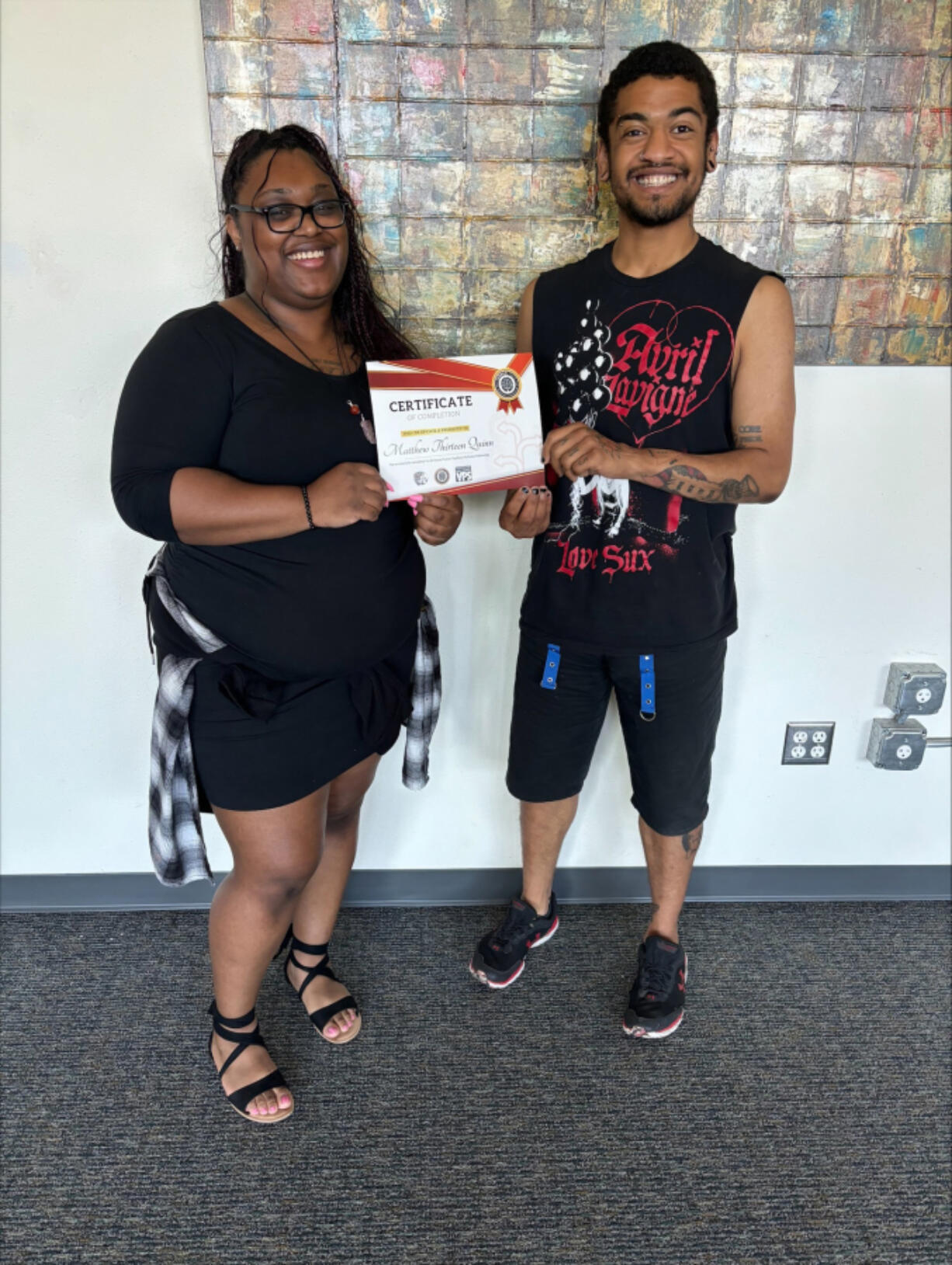 Program coordinator Simone Thomas, left, poses with Matthew &ldquo;Matty&rdquo; Quinn, a recent graduate of iUrban Teen&rsquo;s Future Teachers Pathway Fellowship, which offers prospective educators a paid opportunity to spend time in local classrooms before diving into careers in education.