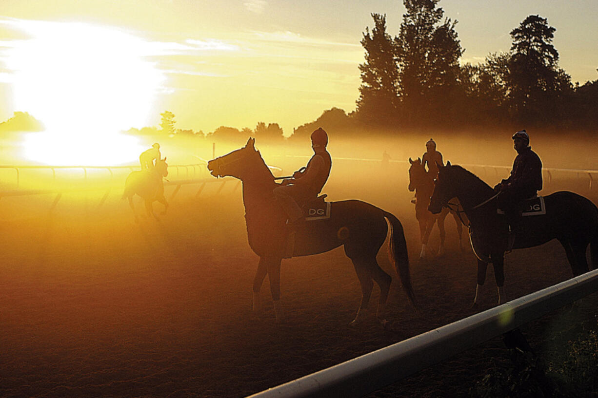FILE &mdash; A fog burns off as the sun rises over the Oklahoma Training Track, in Saratoga Springs, N.Y., Aug. 26, 2005. Venerable Saratoga Race Course adds to its mystique and tradition by hosting the Belmont Stakes for the next two years. The track that predates the end of the U.S. Civil War has never before hosted a Triple Crown race.