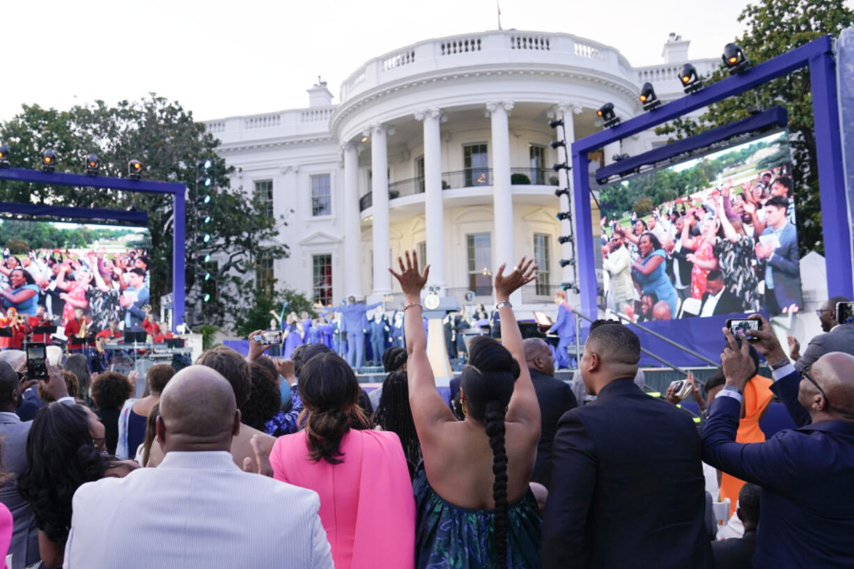 FILE - Guests respond as Broadway Inspirational Voices performs during a Juneteenth concert on the South Lawn of the White House in Washington, June 13, 2023. Biden will celebrate the Juneteenth holiday early with a concert on the White House South Lawn on Monday night. Singers Gladys Knight and Patti LaBelle will be among the performers. Biden signed a law in 2021 that made June 19, or Juneteenth, a federal holiday.