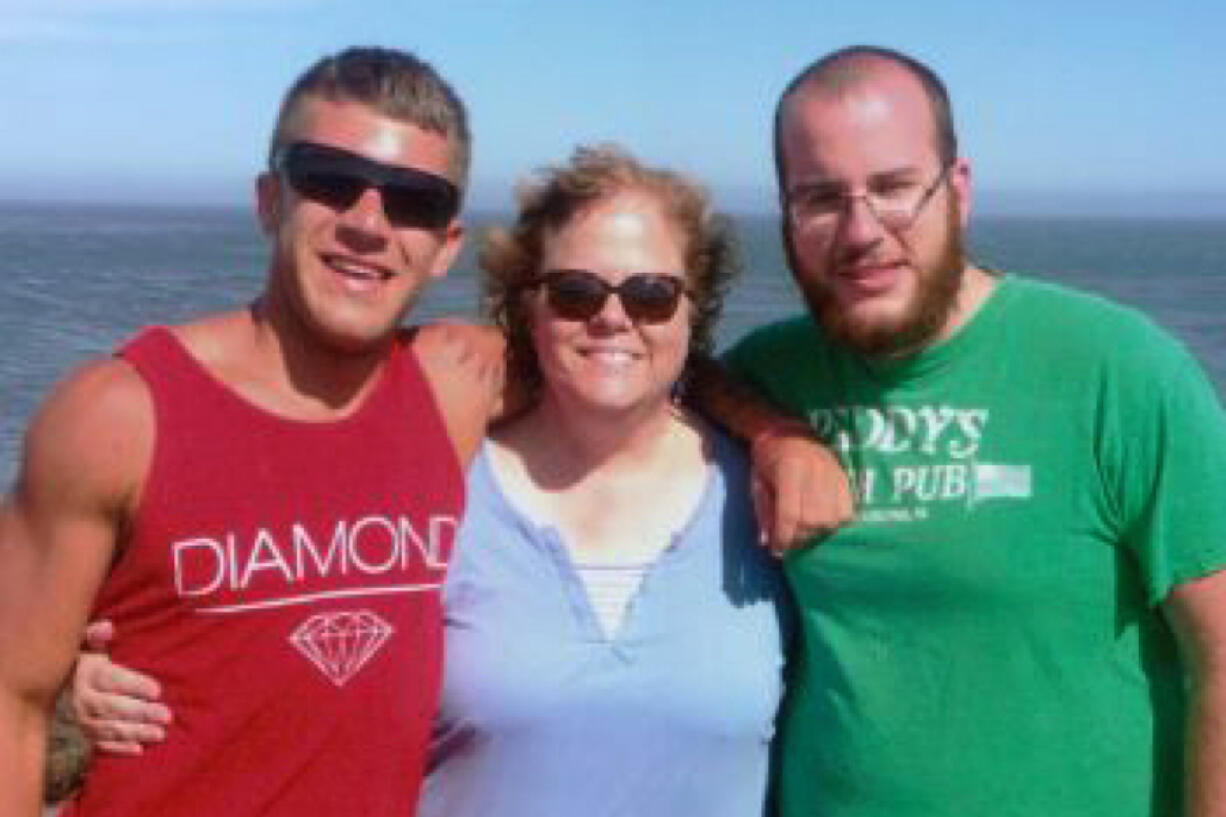 Susan Riffel, center, poses with her sons Melvin, left and Bennett in this undated photo provided by Ike Riffel. Melvin and Bennett Riffel died in the 2019 crash of Boeing 737 Max plane in Ethiopia. Their father Ike Riffel fears that instead of putting Boeing on trial, the U.S. government will offer the company another shot at corporate probation through a legal document called a deferred prosecution agreement, or DPA.