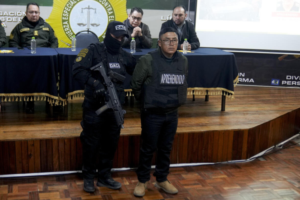 Sergeant Demetrio Mamani is presented to the press in handcuffs by police after his arrest in La Paz, Bolivia, Friday, June 28, 2024. Bolivian government officials said Friday they arrested four more people in connection with Wednesday&rsquo;s failed coup attempt against President Luis Arce, bringing the total detained to 21.