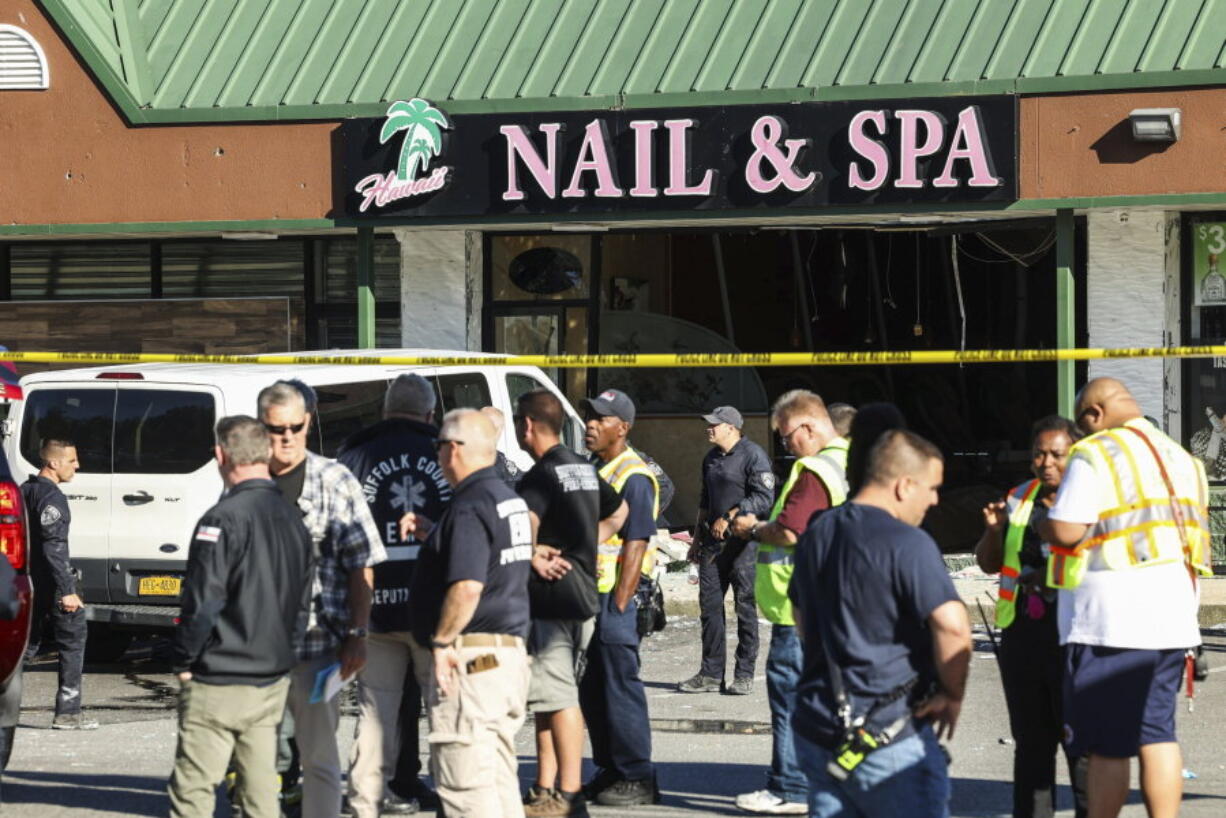 Emergency personnel respond to a scene after a vehicle drove into Hawaii Nail &amp; Spa, killing and injuring multiple people Friday, June 28, 2024, in Deer Park, N.Y.