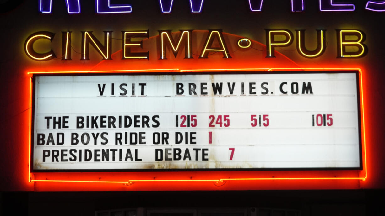 The presidential debate is displayed on the marquee of Brewvies Cinema Pub in advance of the debate between President Joe Biden and Republican presidential candidate former President Donald Trump, Wednesday, June 26, 2024, in Salt Lake City.