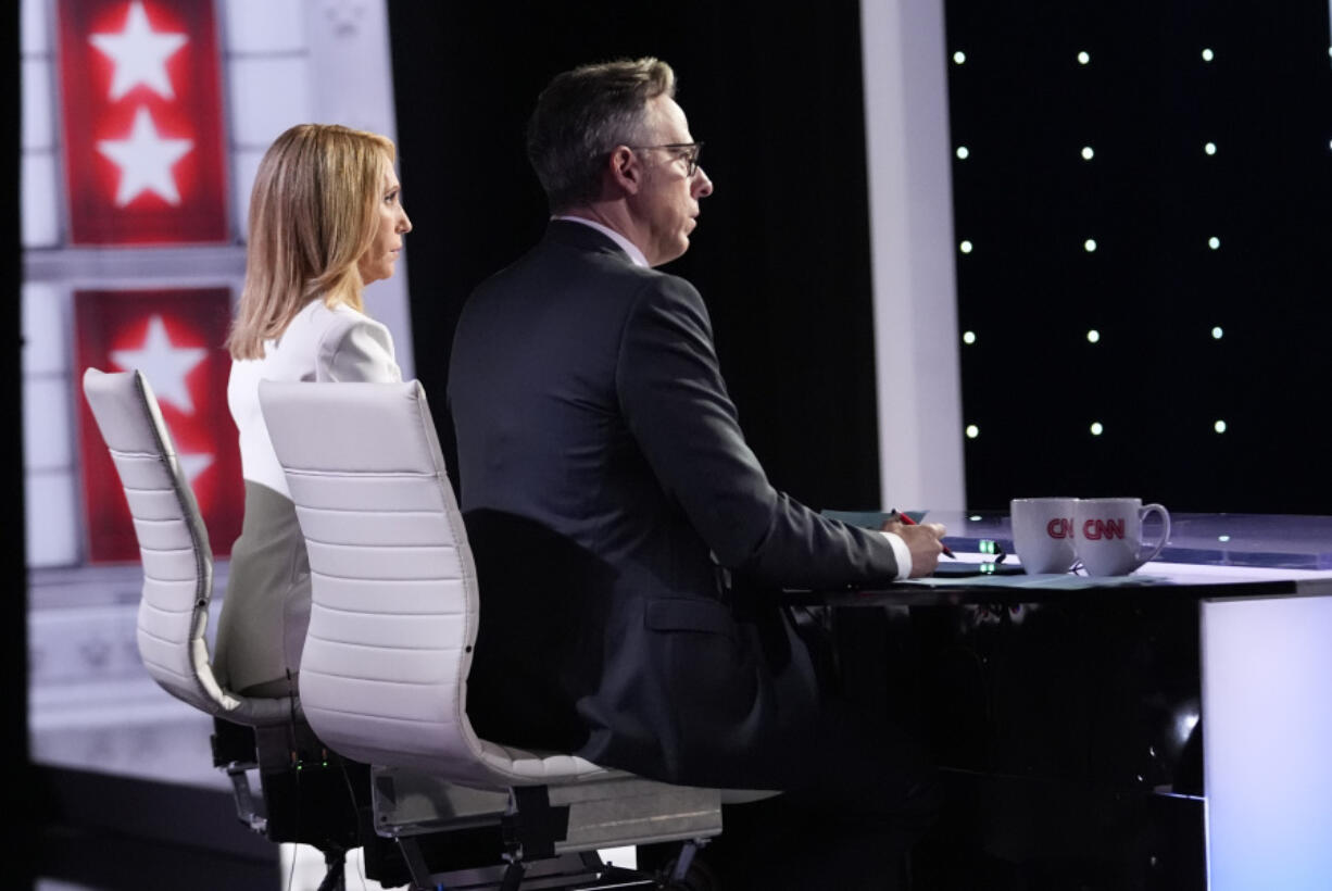 CNN&rsquo;s Dana Bash, left, and Jake Tapper listen as they moderate a presidential debate between President Joe Biden and Republican presidential candidate former President Donald Trump, Thursday, June 27, 2024, in Atlanta.