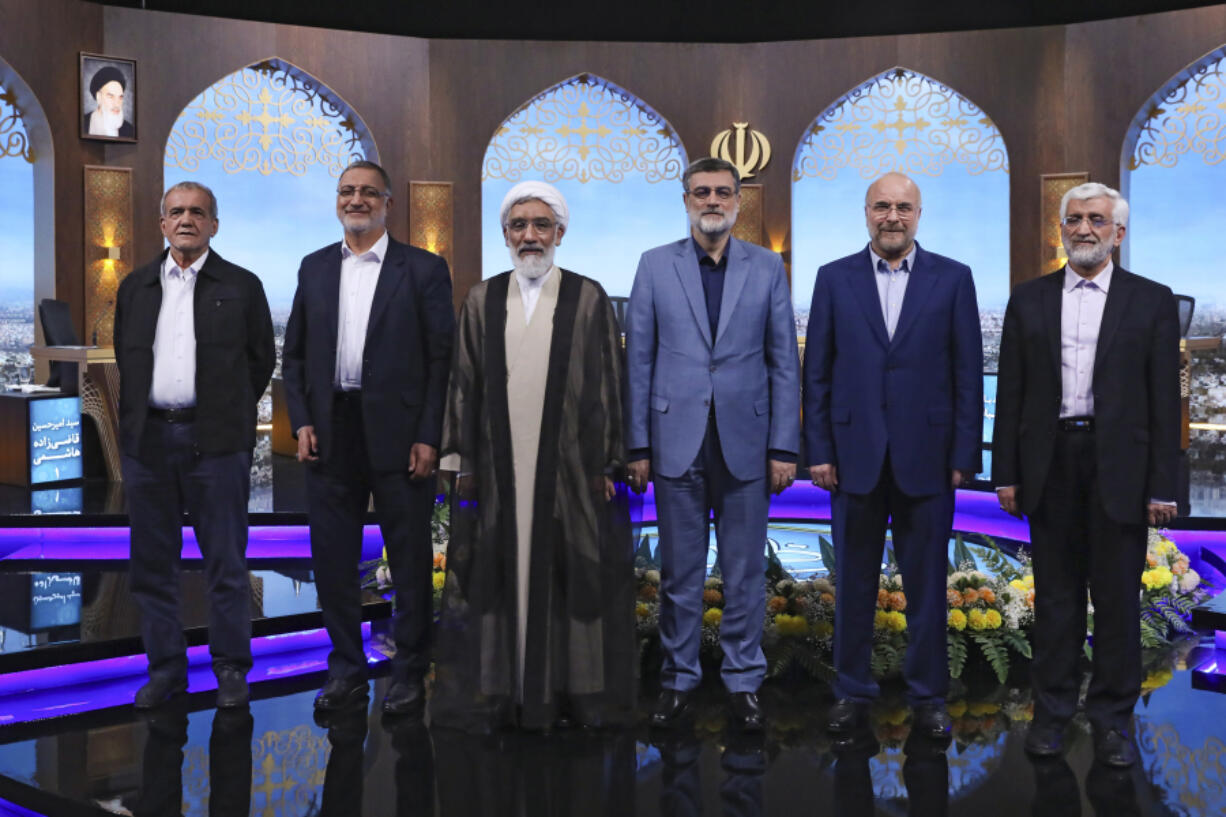 FILE - In this picture made available by Iranian state-run TV, IRIB, presidential candidates for June 28, election from left, Masoud Pezeshkian, Alireza Zakani, Mostafa Pourmohammadi, Amirhossein Ghazizadeh Hashemi, Mohammad Bagher Qalibaf, and Saeed Jalili pose for a photo after the conclusion of their debate at the TV studio in Tehran, Iran, June 25, 2024. Even in a busy year of elections, the next few days stand out. Voters go to the polls over the next week in fledgling democracies like Mauritania and Mongolia, in the Islamic Republic of Iran and in the stalwart democracies of Britain and France.