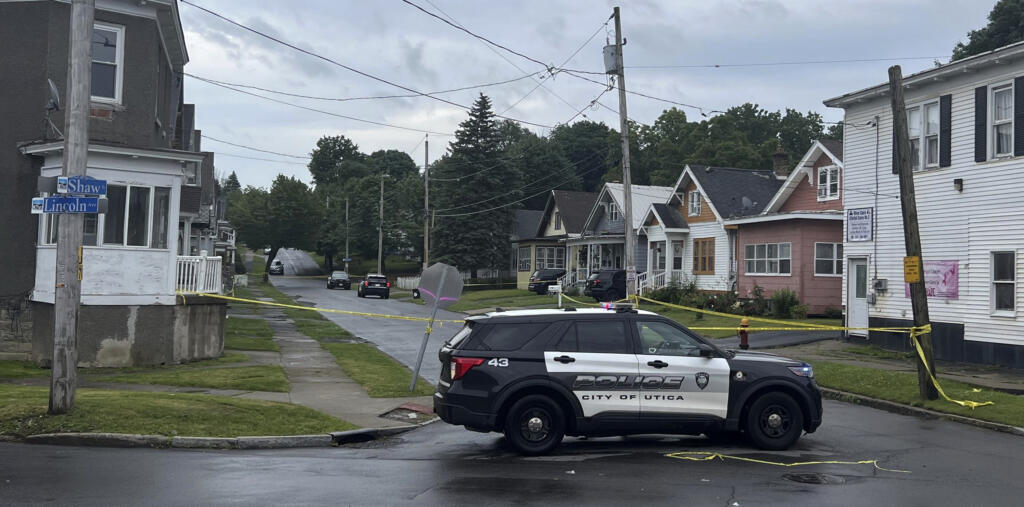 Police investigate the scene of Friday nights shooting in Utica, N.Y., early Saturday, June 29, 2024. An officer shot and killed a teen fleeing while pointing a replica gun, police said Saturday.
