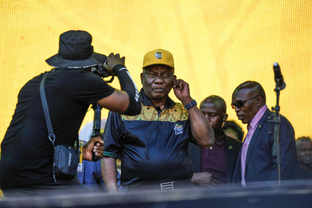 South African President Cyril Ramaphosa greets African National Congress supporters at the Siyanqoba rally at FNB stadium in Johannesburg, South Africa, Saturday, May 25, 2024. South African will vote in the 2024 general elections May 29.