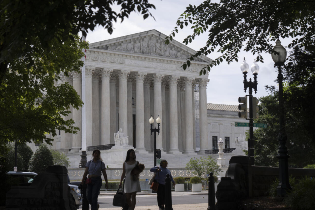 People walk past the Supreme Court on Thursday, June 27, 2024, in Washington.